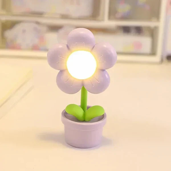 Plastic LED flower lamp, BlossomGlow, an ambient table light and charming gift for any room.