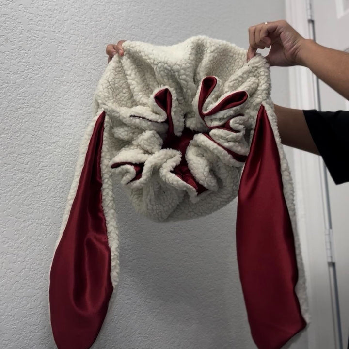 Cozy women's bunny bonnet, a charming winter accessory for warmth and gentle hair care.