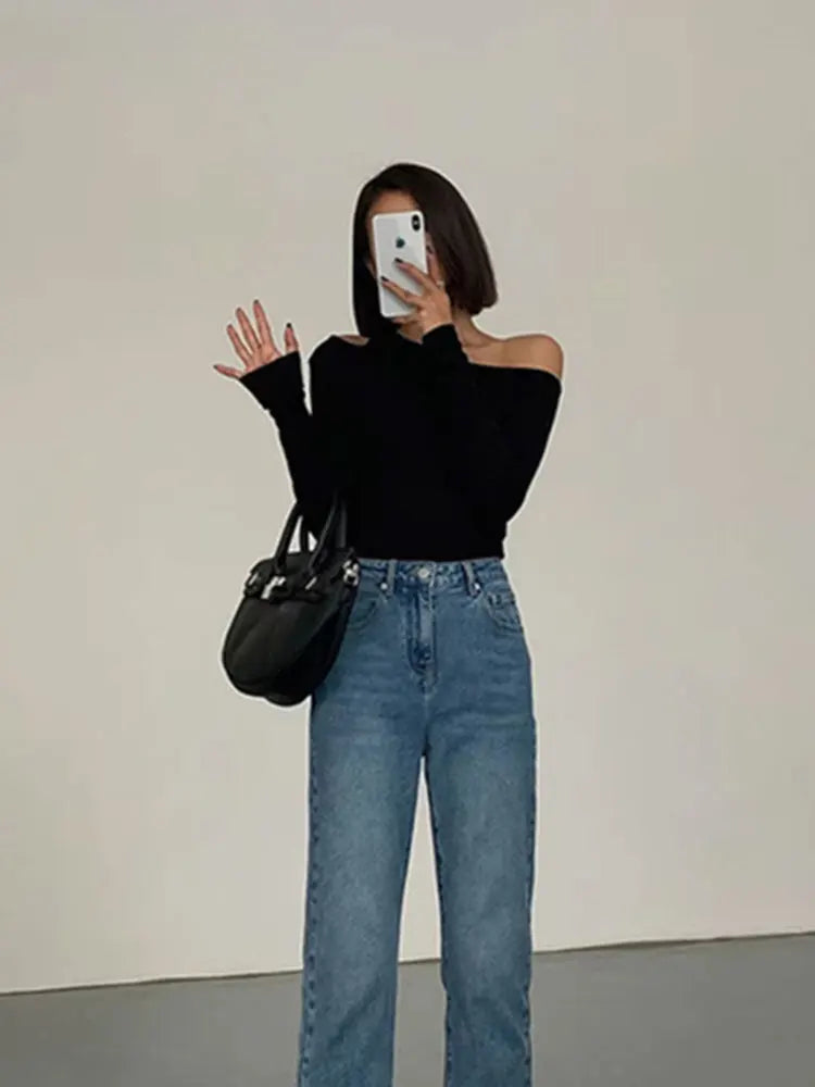 Comfortable women's off-shoulder top with long sleeves in black, a versatile & trendy piece for casual spring fashion.