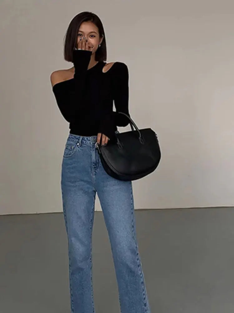 Trendy women's off-shoulder long sleeve black top, featuring effortless style & chic design for fashion-forward comfort.