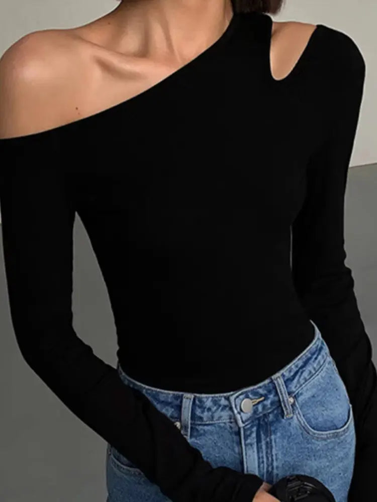 Versatile women's black off-shoulder top with long sleeves, offering a comfortable & chic style for trendy daily wear.