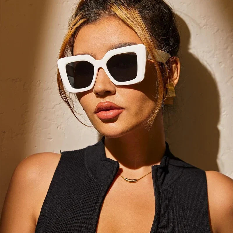 Fashion-forward Valencia Classic sunglasses for men & women, with sleek black frames and essential UV protection.