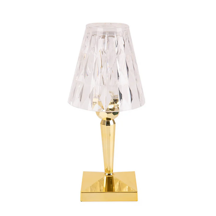 Crystal design table lamp providing ambient light for living room or bedroom.