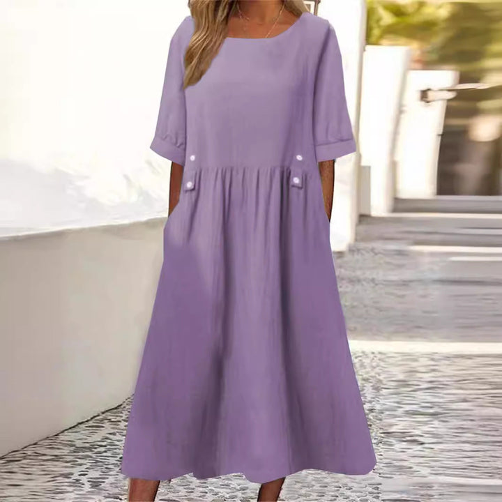 Chic everyday women's midi dress with a loose fit and round neck, perfect for comfortable summer casual wear.