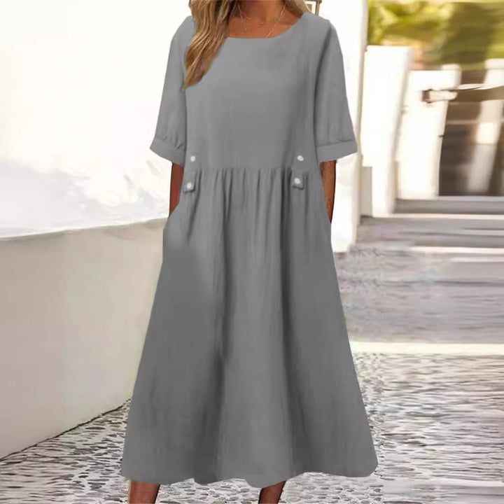 Women's chic midi dress for everyday wear. Comfortable, loose-fit summer dress with a stylish round neck.