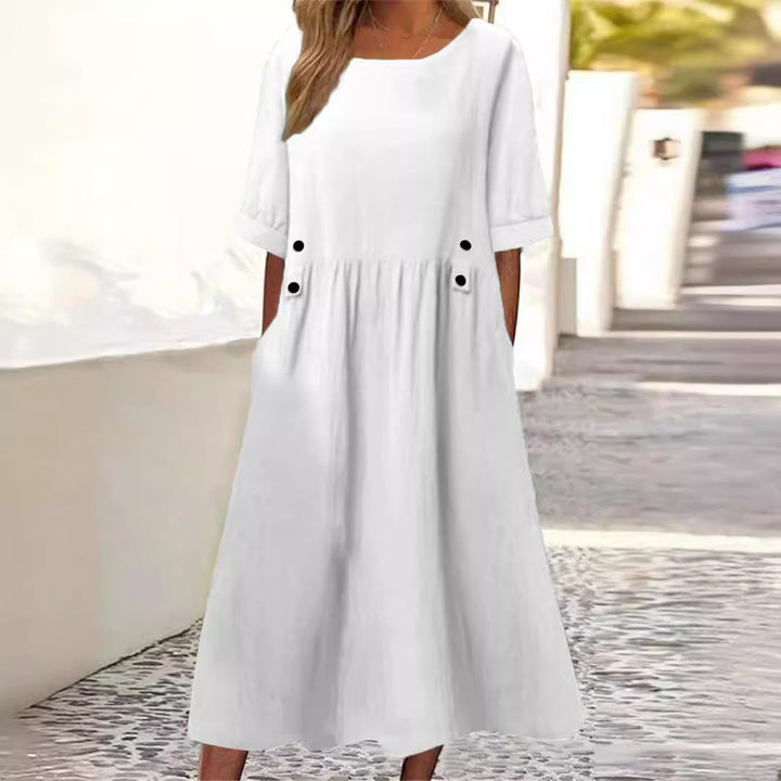 Comfortable loose-fit women's midi dress, perfect for casual everyday wear. Stylish round neck summer apparel.