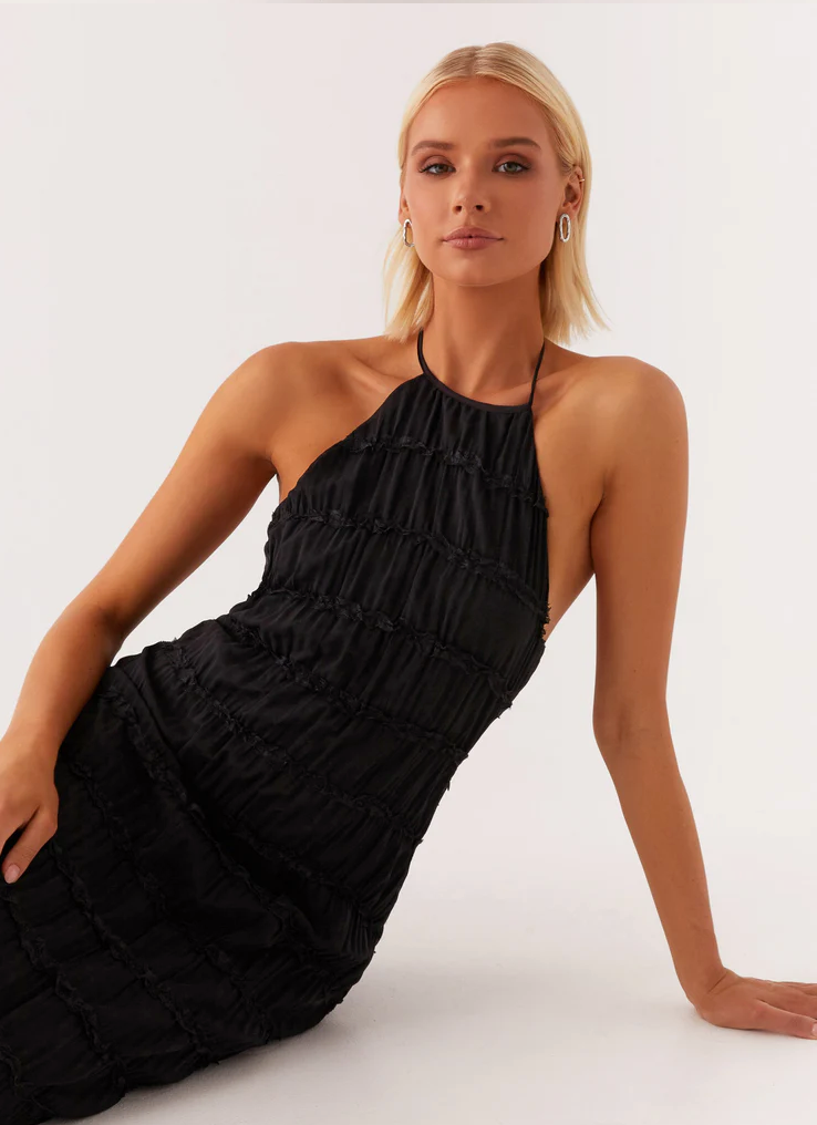 Beautiful women's halter maxi dress, a stylish and comfortable choice for wedding guests.