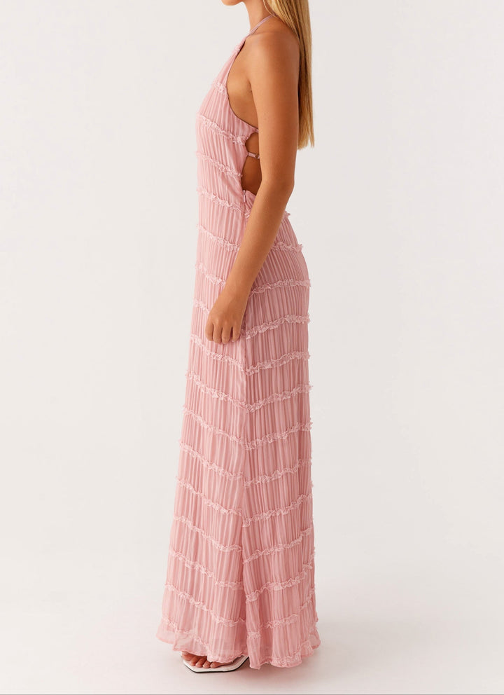 Sophisticated textured halter maxi dress with an open back, ideal for wedding guests.
