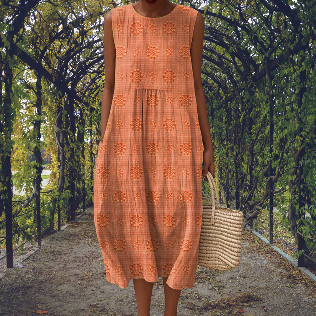 Comfortable women's pleated sleeveless summer dress with a flowy midi length, perfect for warm days.