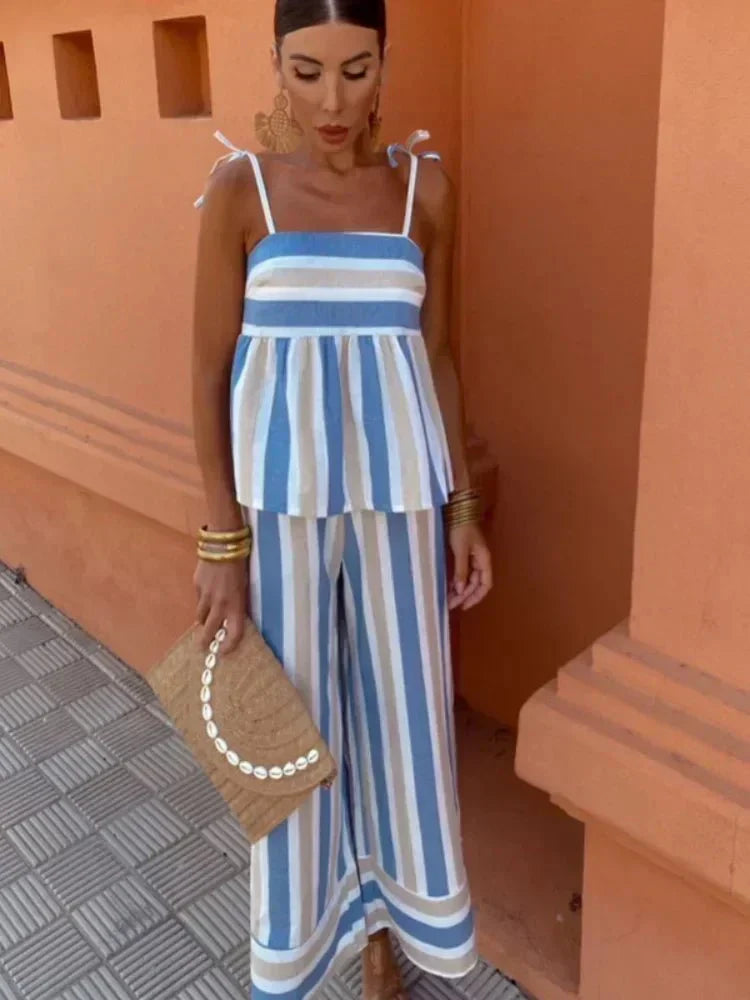 Chic striped wide leg two-piece set for women. Elegant peplum top & pants, perfect for wedding guests or summer parties.