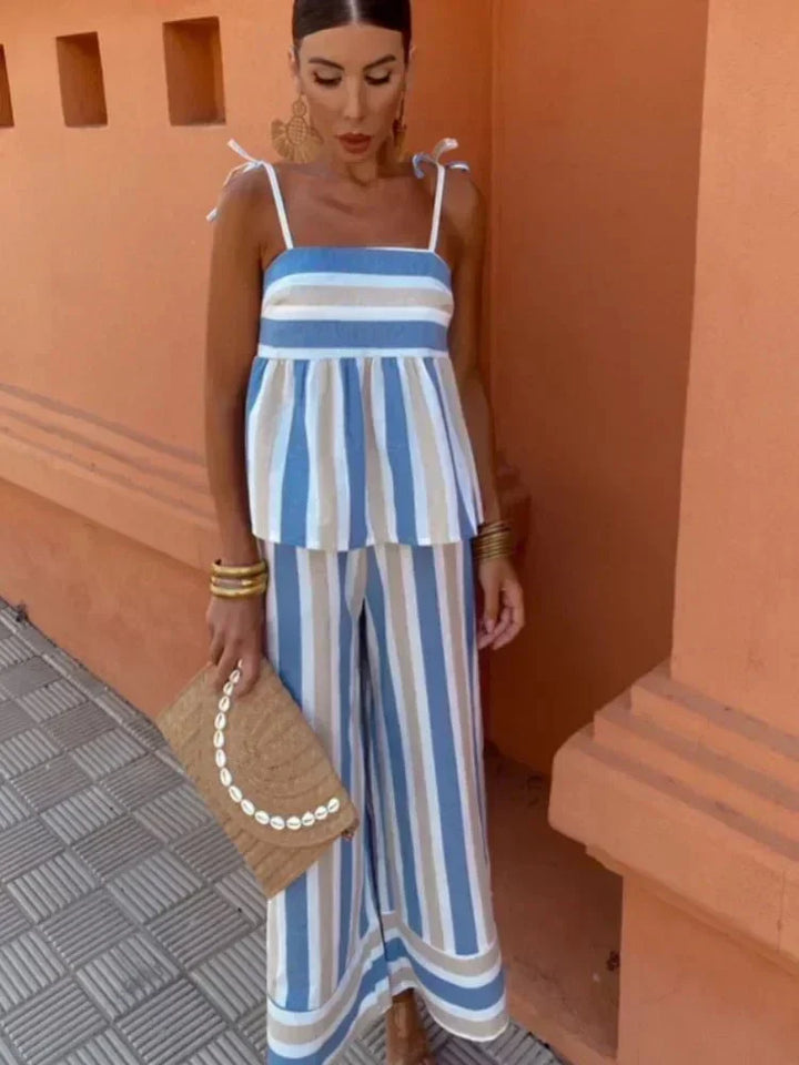 Chic striped wide leg two-piece set for women. Elegant peplum top & pants, perfect for wedding guests or summer parties.