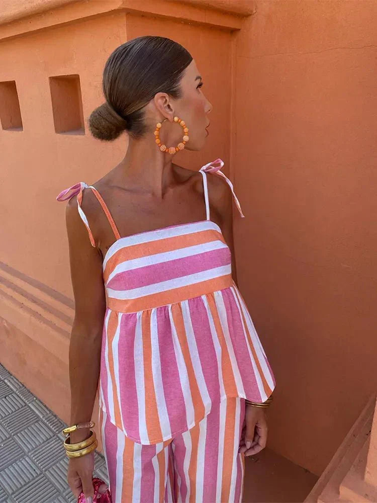 Women's elegant striped wide leg two-piece set. Features a chic peplum top, ideal for wedding guests & garden parties.