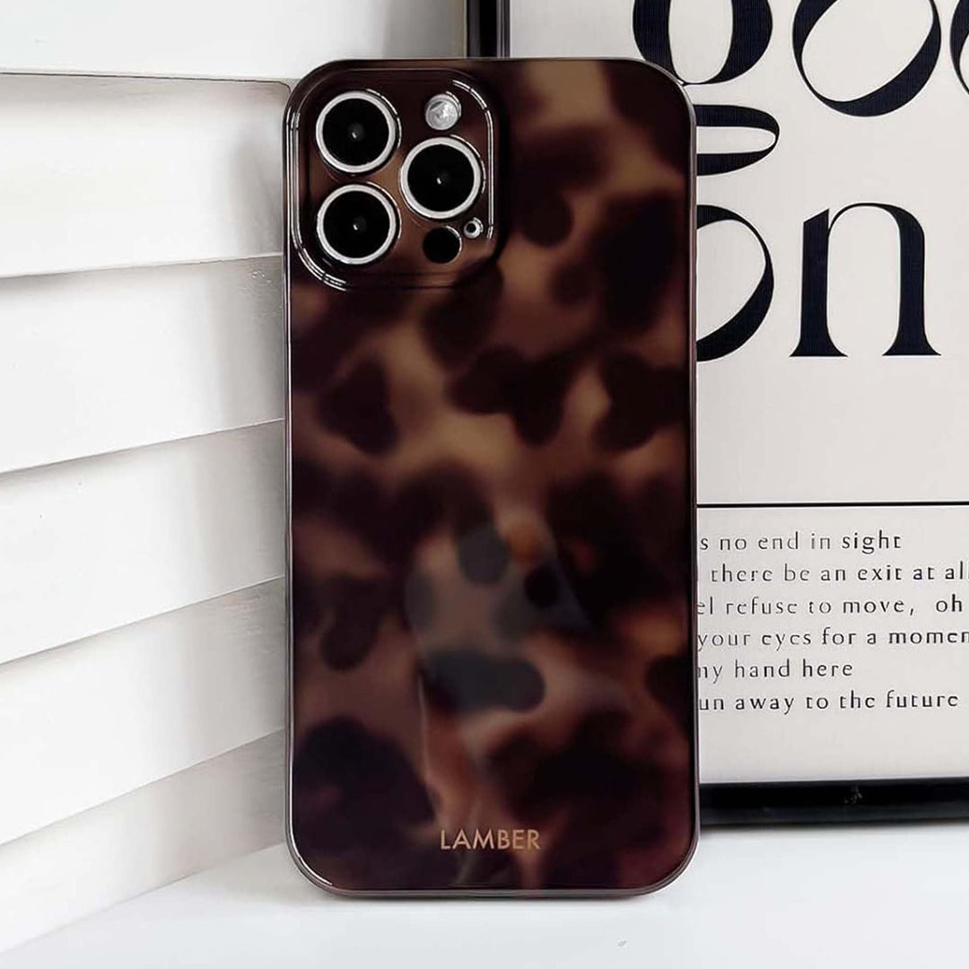 Chic tortoiseshell glass iPhone case, a stylish & protective phone cover with a unique pattern.