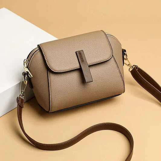 Chic vegan leather crossbody bag for women with adjustable strap.
