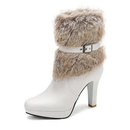 Profile view of elegant women's heeled ankle boots in black, showcasing the buckle and sleek silhouette.