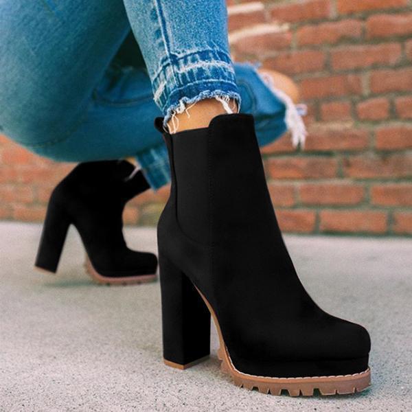 Fashionable women's slip-on ankle boots with a modern platform heel & stable block heel, enhancing any outfit.