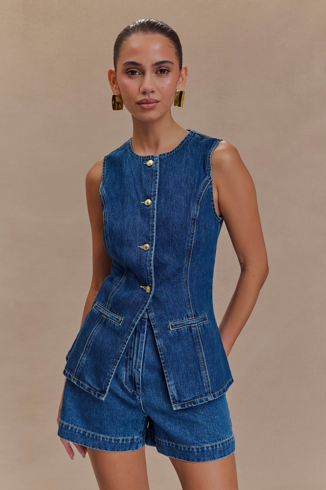 Chic women's blue denim two-piece set, trendy & comfortable, perfect for casual wear. Stylish matching denim outfit.