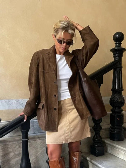 Women's chic brown suede long sleeve jacket. Perfect fall coat for elegant style or sophisticated autumn outfits.