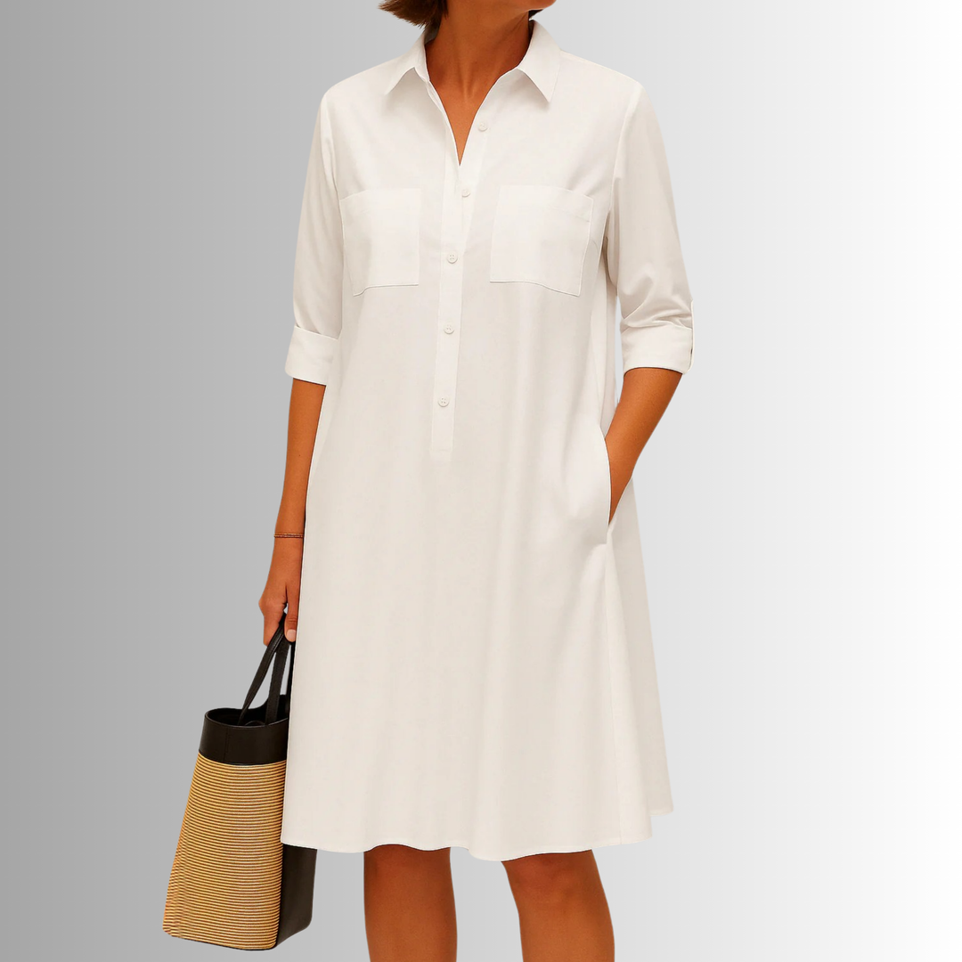 Elegant green button-front A-line dress for women. A versatile summer dress with a classic collar and pockets.