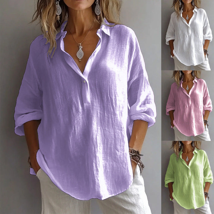 Lightweight women's button-up blouse, long flowing sleeves, breathable fabric for versatile everyday wear.