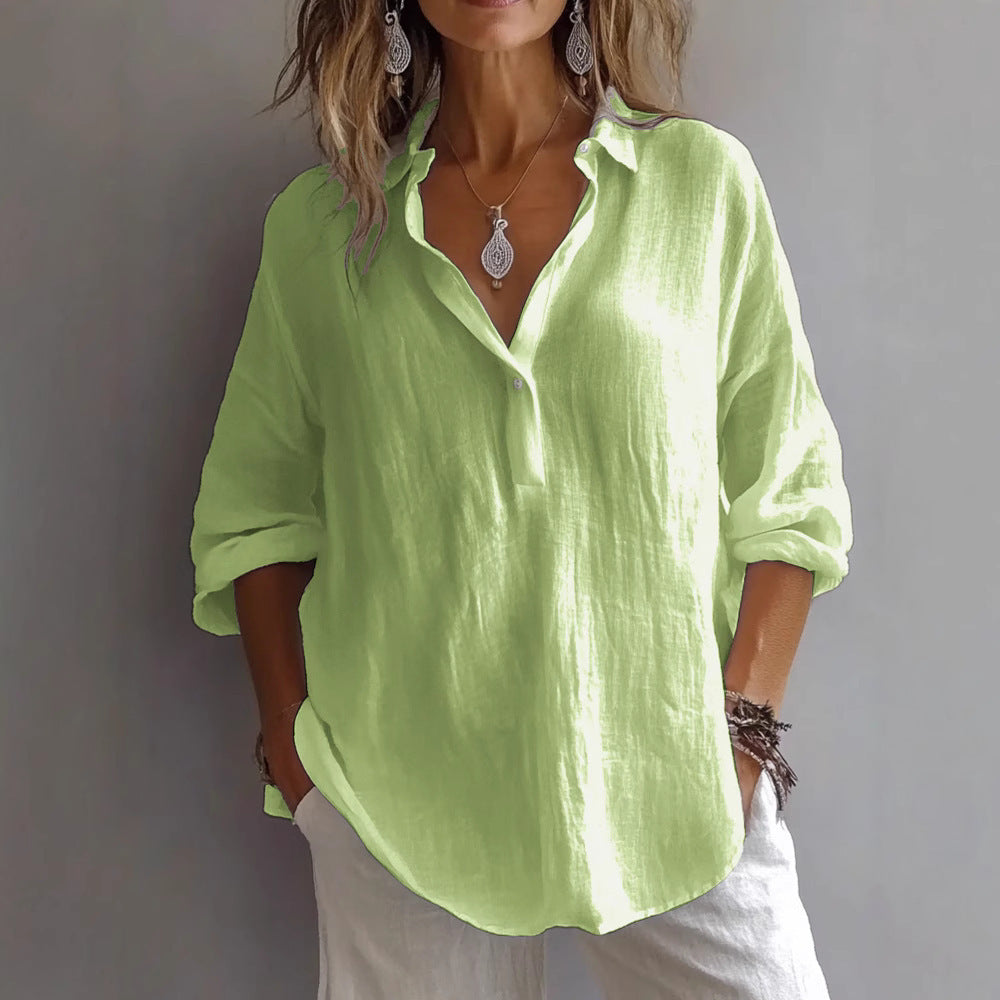Modern women's button-up blouse with wide flowing sleeves, a breathable and lightweight everyday top.