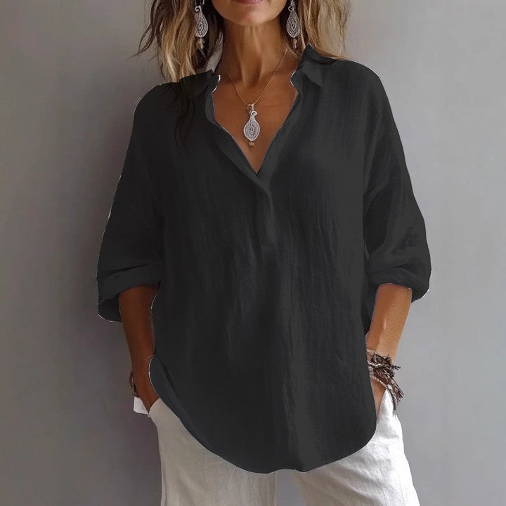 Casual women's button-up shirt, elegant flowing long sleeves, designed for breathable and comfortable wear.