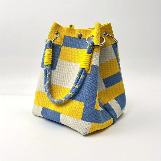 Chic women's canvas mini bucket bag, ideal for modern fashion. Features striped & patchwork design. Shoulder/crossbody.