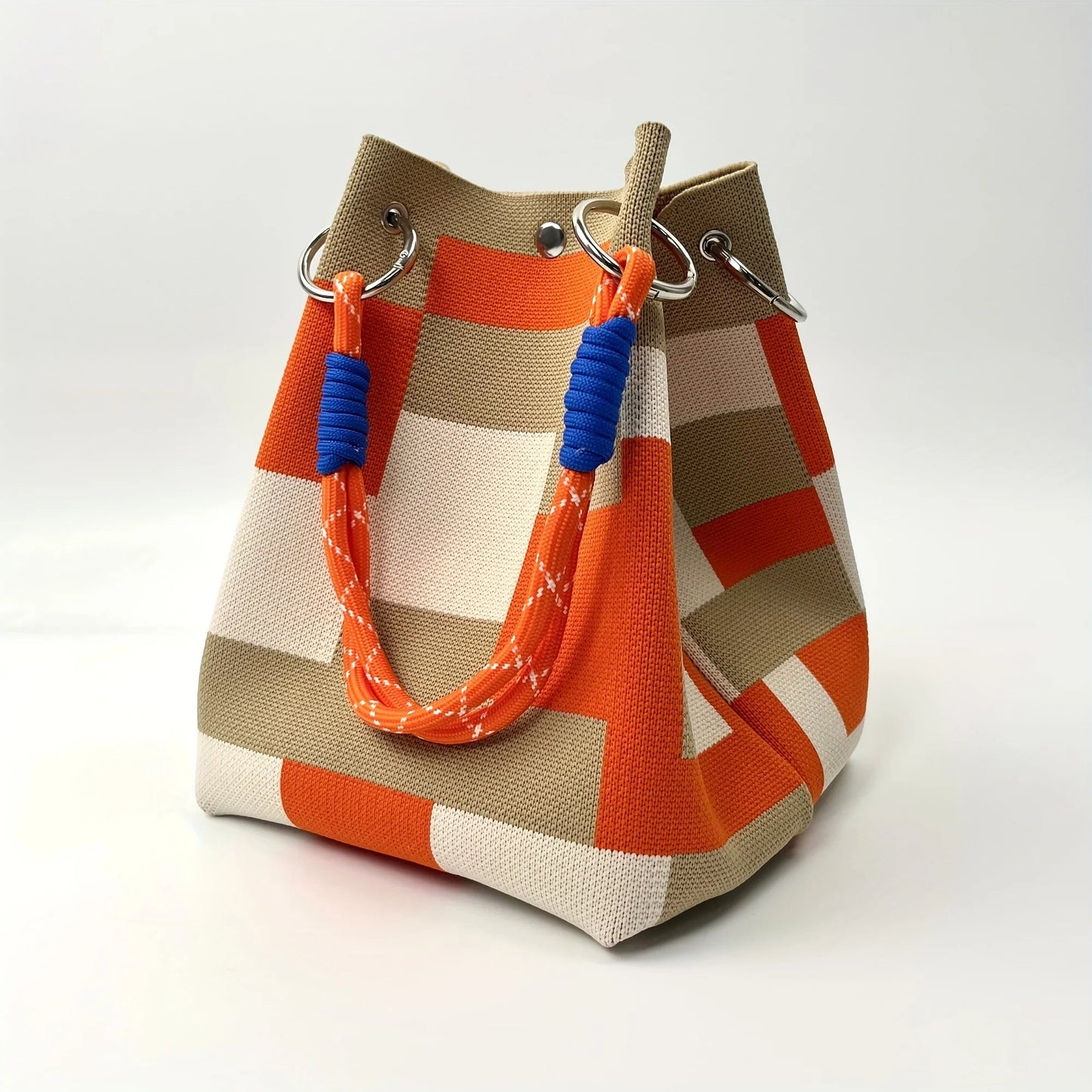 Women's patchwork canvas mini bucket bag with stripes, a chic shoulder or crossbody accessory for modern style.