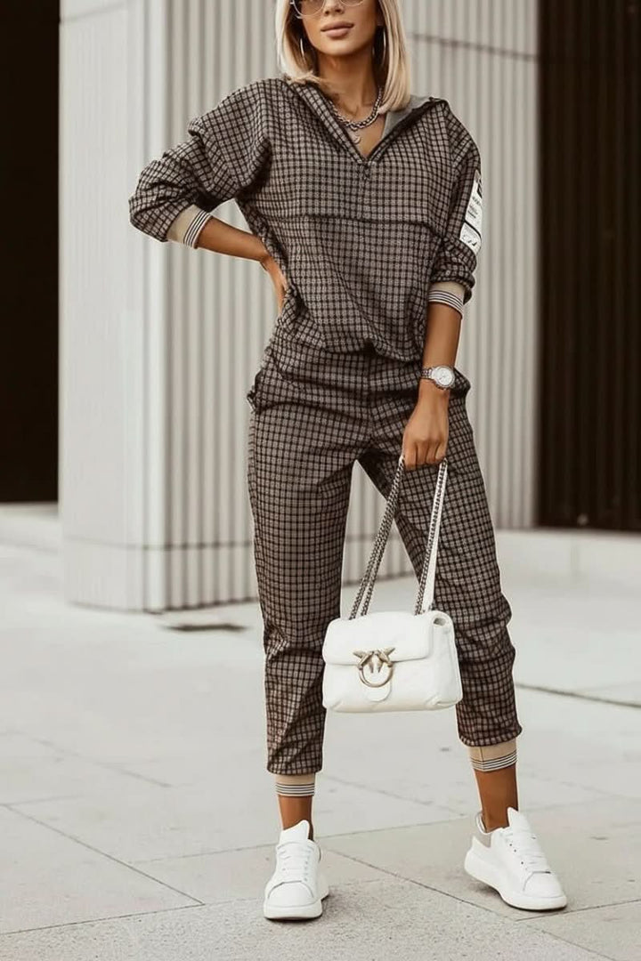 Stylish athleisure women's tracksuit. Matching two-piece set offers ultimate comfort for active or casual days.