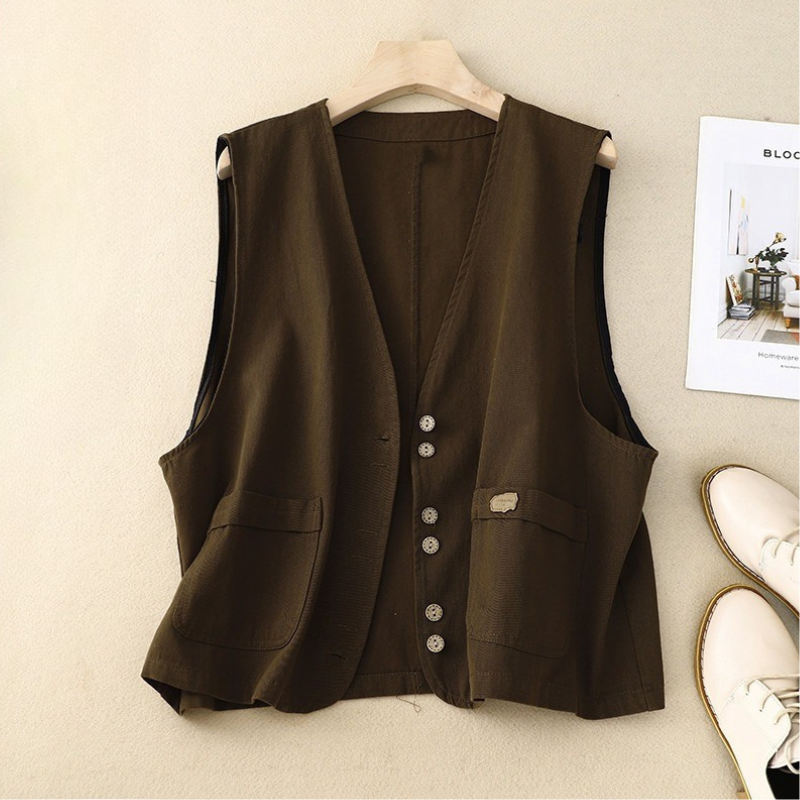 Casual chic women's sleeveless layering vest. Cotton-linen blend, with functional pockets. Great for versatile outfits.
