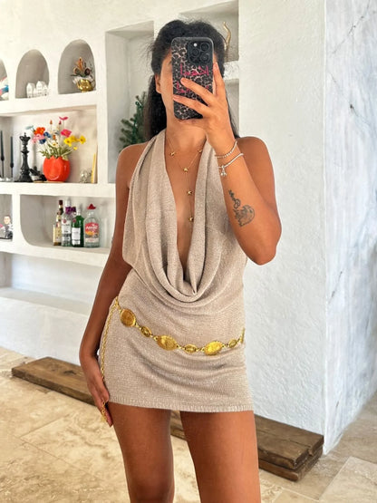 Sleeveless backless mini dress for women with a deep V-neck, offering a flirty and chic look for parties.