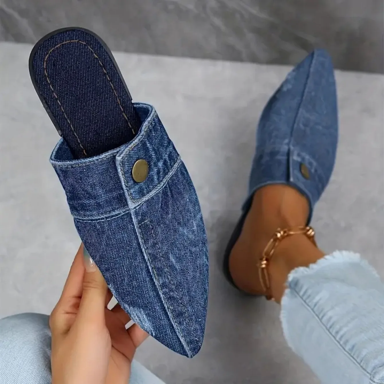 Women's denim slip-on mule slides, combining chic style with comfortable, easy-to-wear footwear.