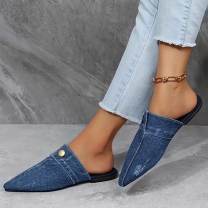 Chic denim mule slides for women, featuring a pointed toe and effortless slip-on style for modern fashion.