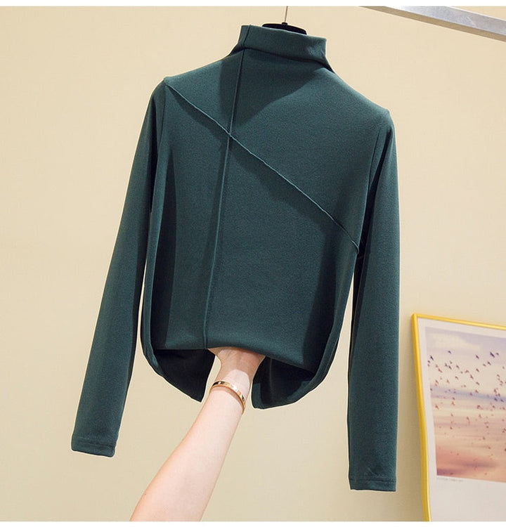 Classic black women's high-neck turtleneck top. Essential long sleeve sweater for versatile fall & winter layering.