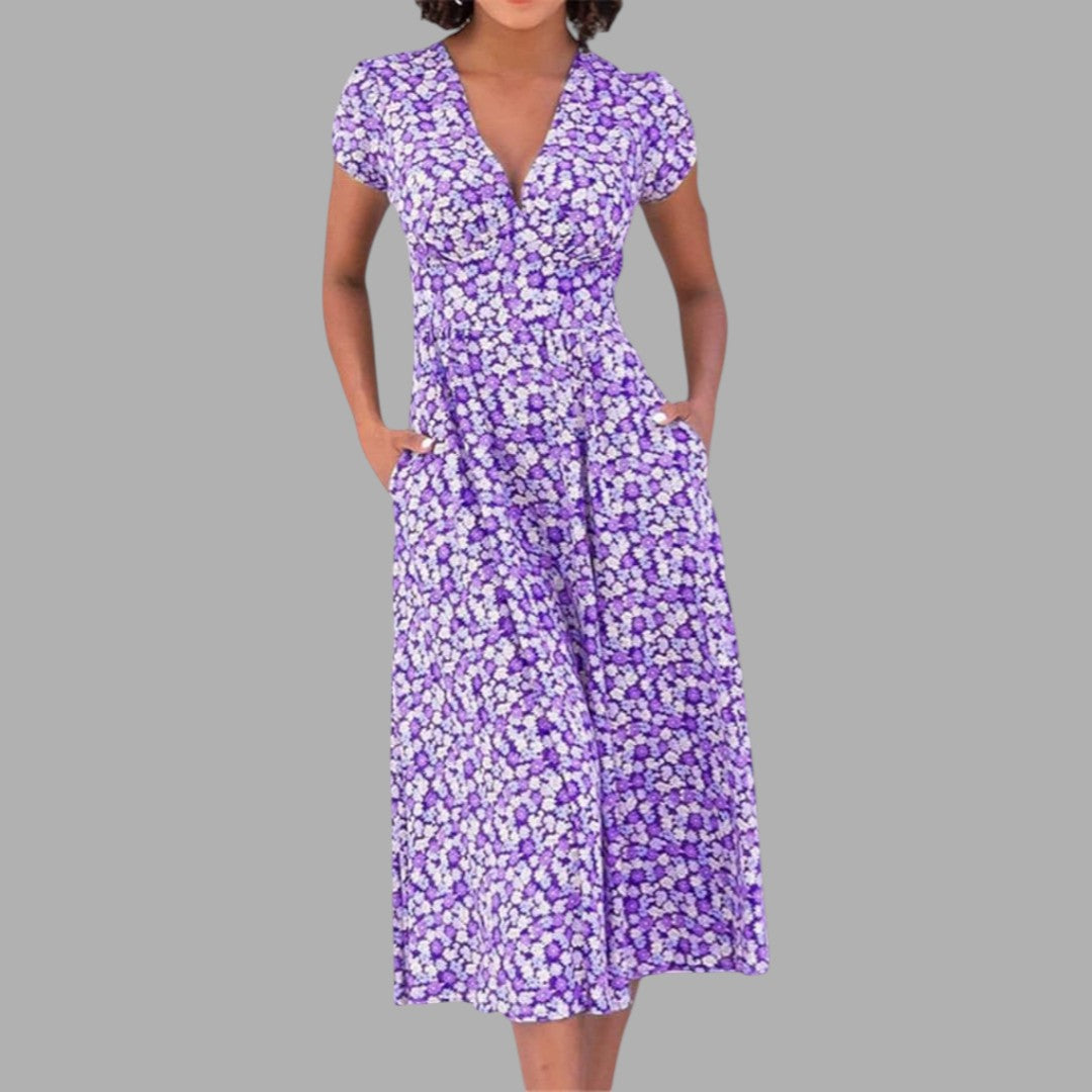 Versatile women's pink floral midi dress. Chic V-neck, short sleeve design ideal for casual or elegant occasions.
