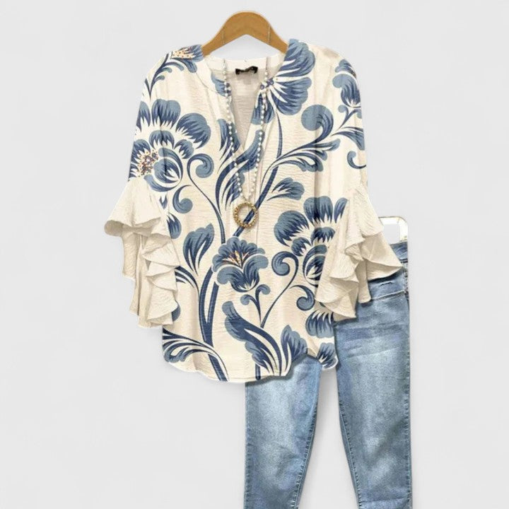 Chic women's floral print blouse with elegant ruffled sleeves, perfect for versatile summer style.
