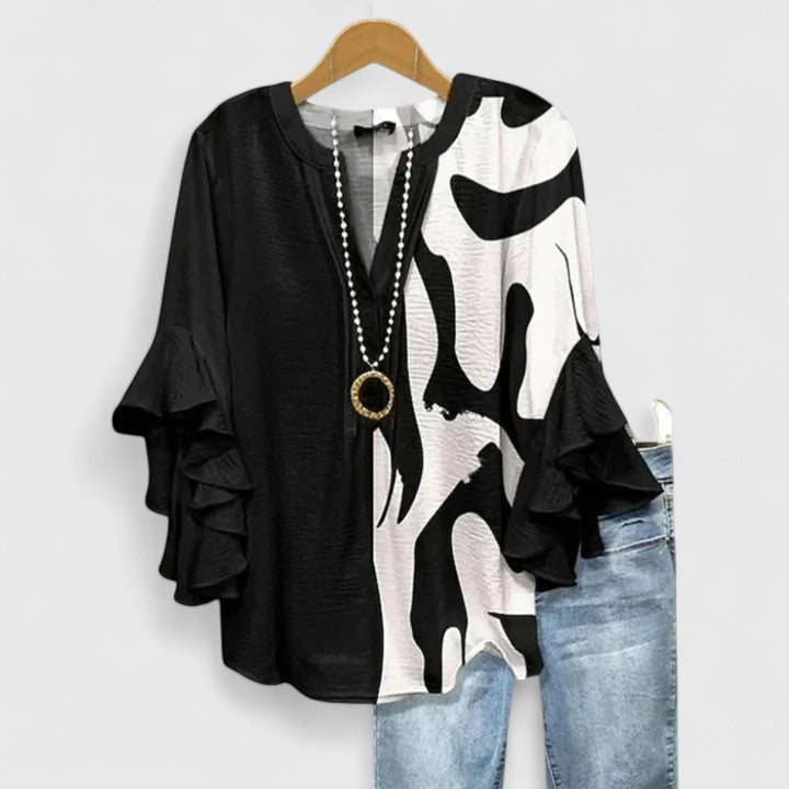 Sophisticated floral print blouse for women, boasting chic ruffled sleeves suitable for any event.