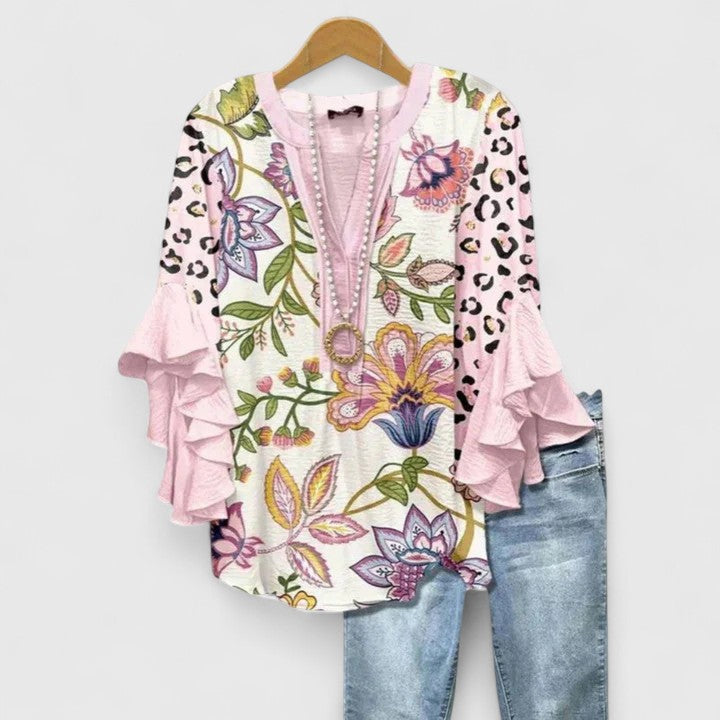 Stylish women's floral print blouse featuring elegant ruffled sleeves, a versatile top for ladies.