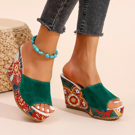 Chic women's floral wedge sandals. Comfortable slip-on footwear with elegant design for effortless style.