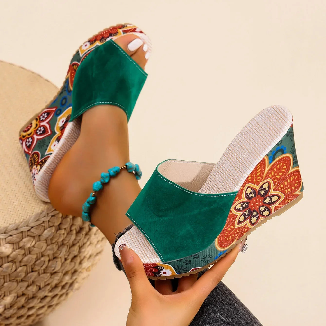 Comfortable women's wedge sandals with beautiful floral print. Chic slip-on mules offering effortless style.
