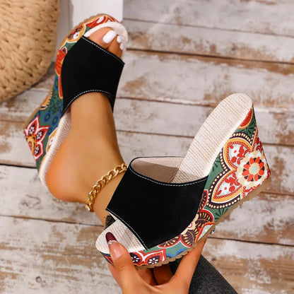 Women's elegant floral print wedge sandals. Slip-on footwear offering a comfortable and stylish look.