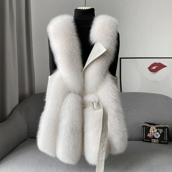 Chic women's fluffy waistcoat in cream, perfect for cozy winter layering. Stylish and elegant fashion vest.