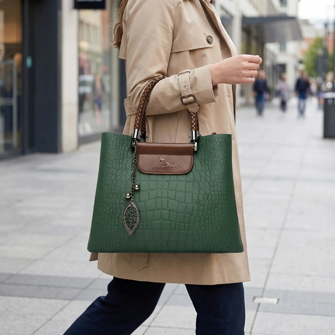 Chic women's green embossed tote bag with elegant braided handle. Perfect versatile shoulder & daily fashion accessory.