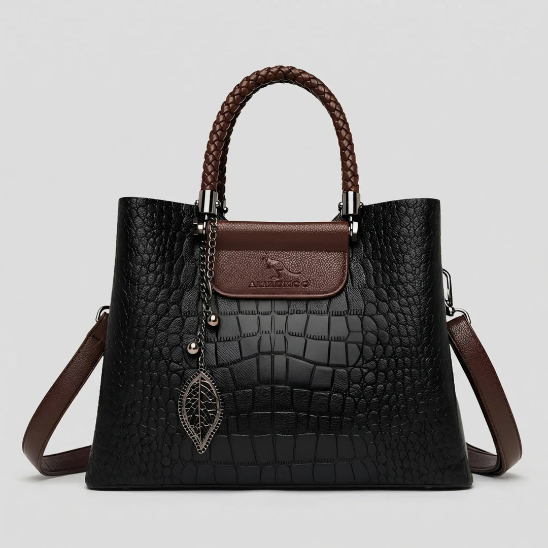 Versatile women's embossed tote bag with a distinctive braided handle. A chic and elegant fashion accessory.