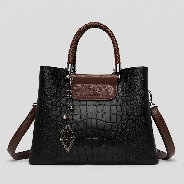Versatile women's embossed tote bag with a distinctive braided handle. A chic and elegant fashion accessory.