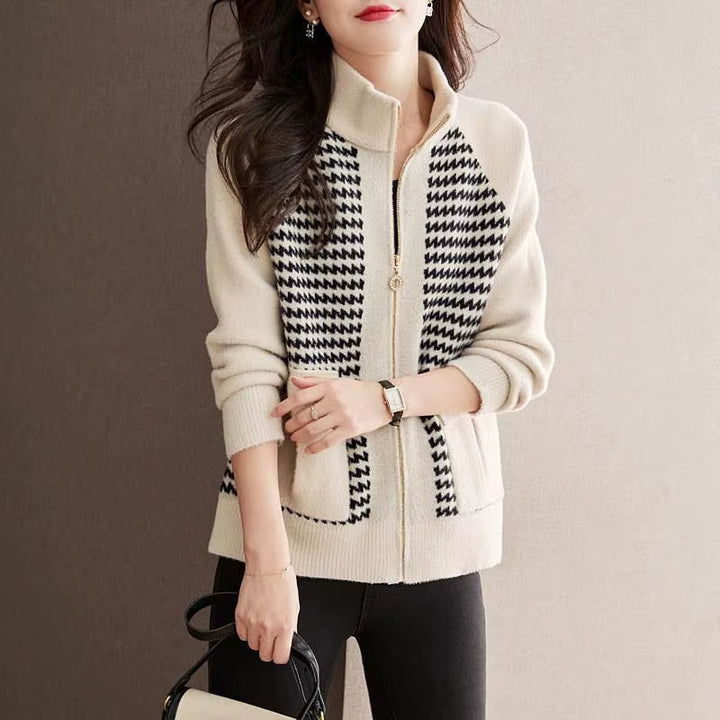 Close-up of a women's houndstooth zip jacket, showcasing its classic pattern and comfortable fabric.