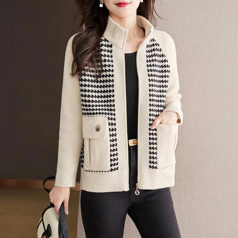 Woman models a casual houndstooth zip jacket, offering comfortable and stylish outerwear for everyday fashion.