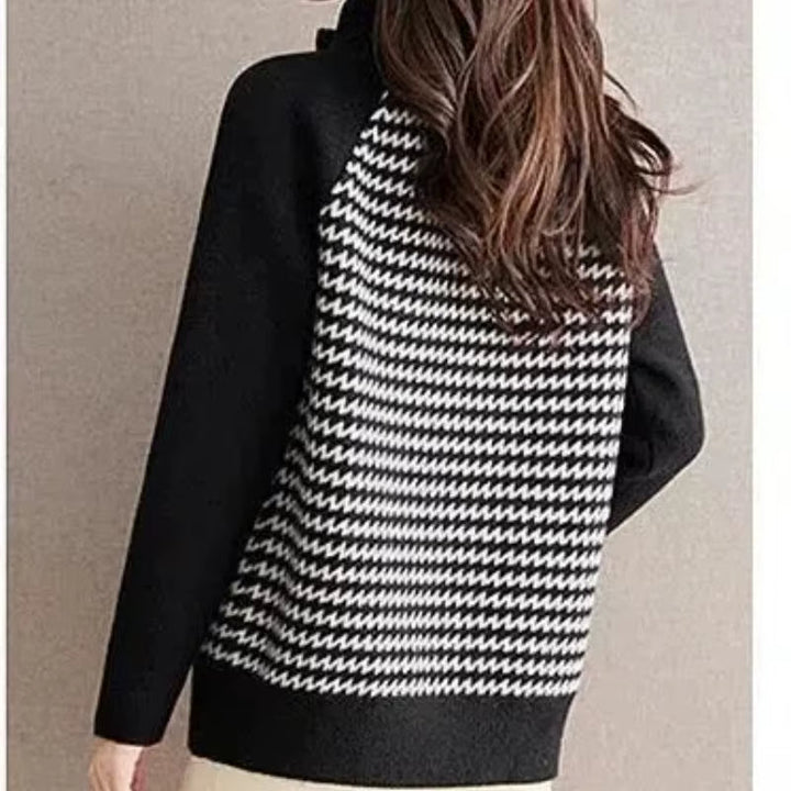 Flat lay of a women's stylish houndstooth zip jacket. Versatile and comfortable outerwear for modern fashion.