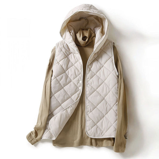 Chic women's lightweight quilted hooded vest. Stylish diamond stitch outerwear for fall & spring layering.