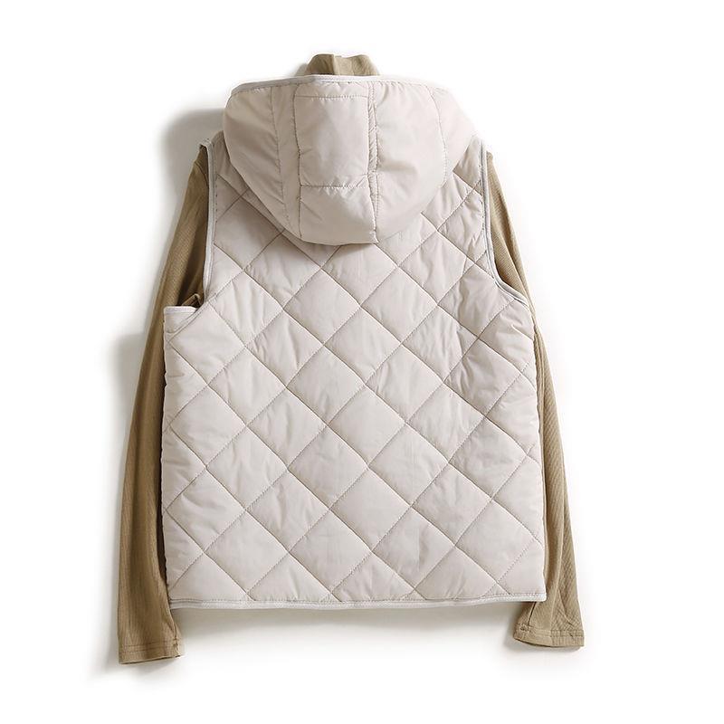 Women's hooded quilted vest, lightweight and chic. Sleeveless jacket for easy layering and casual style.